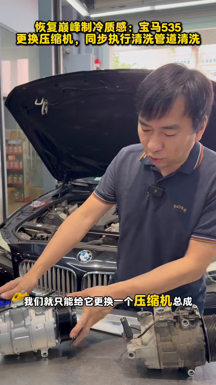 Technician indicating the BMW A/C compressor ports and housing