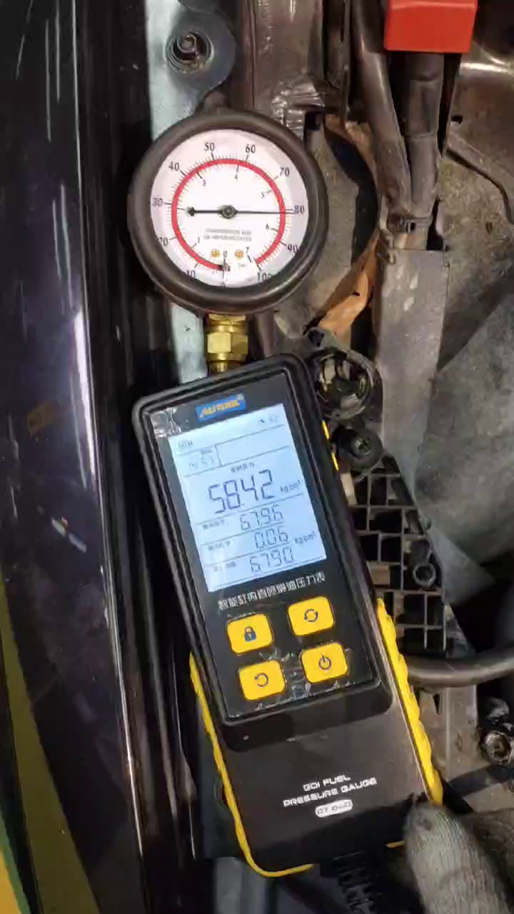 A pressure gauge and digital instrument are connected during fuel testing