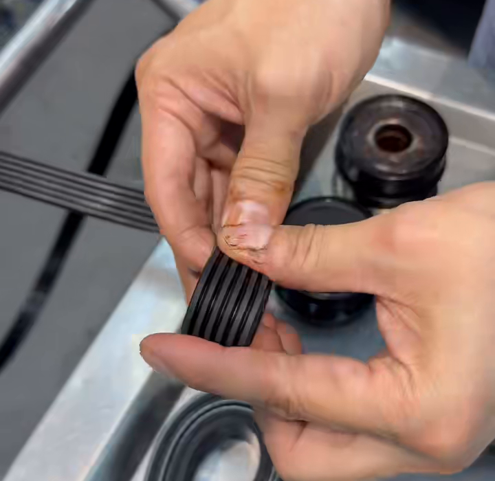 Close view of a removed alternator pulley bearing area.