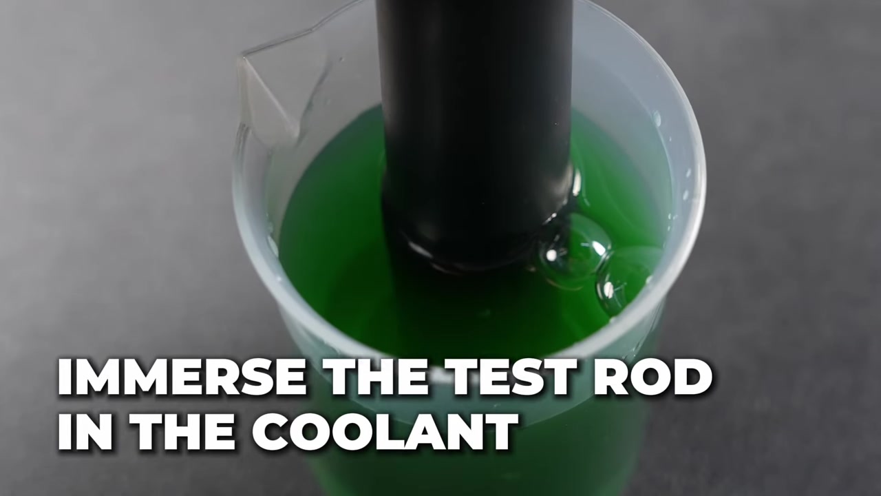 AUTOOL AS509 test rod immersed vertically in an isolated coolant sample beaker