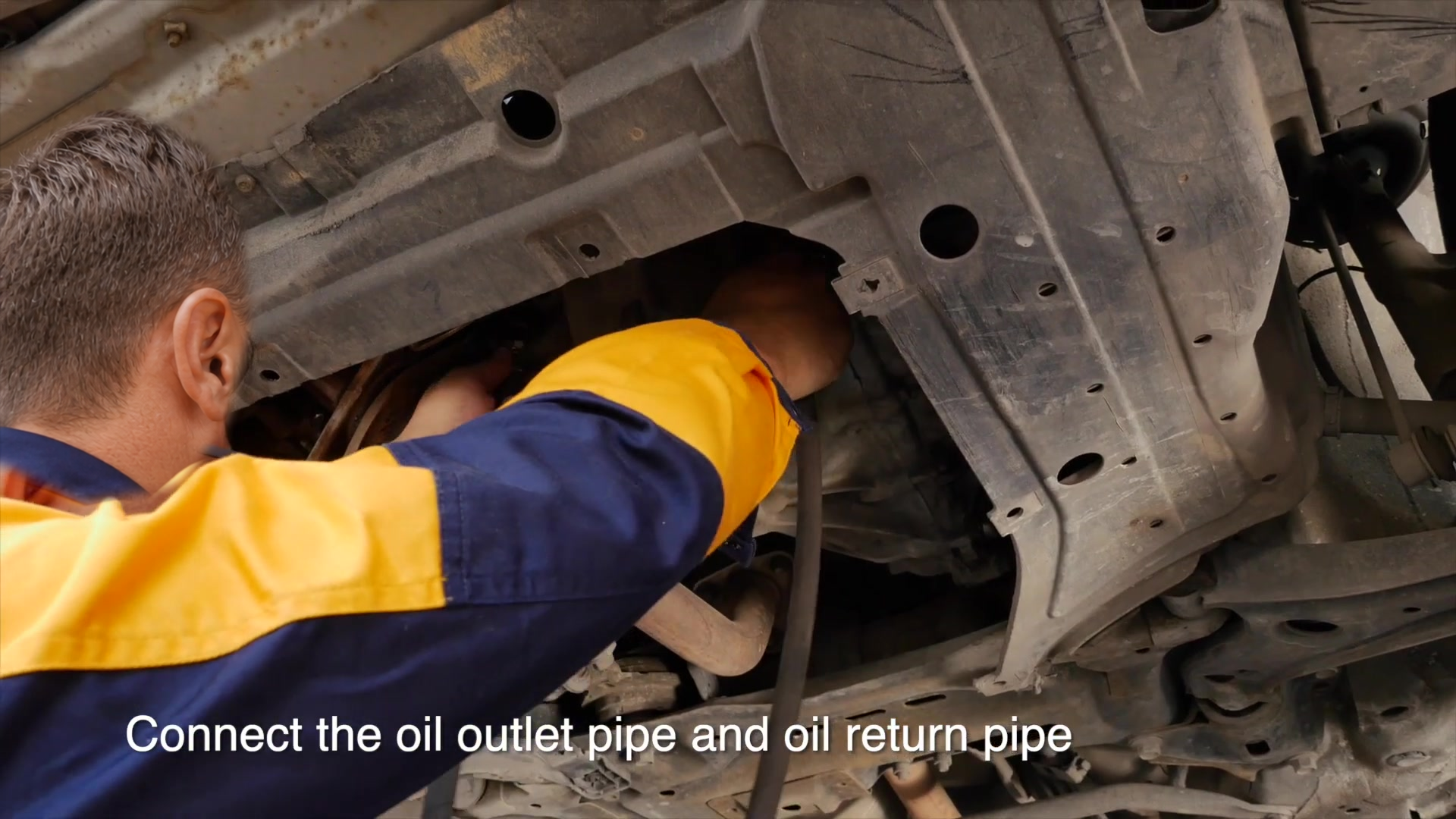 Technician connecting the AUTOOL ATF702 to the transmission cooler circuit