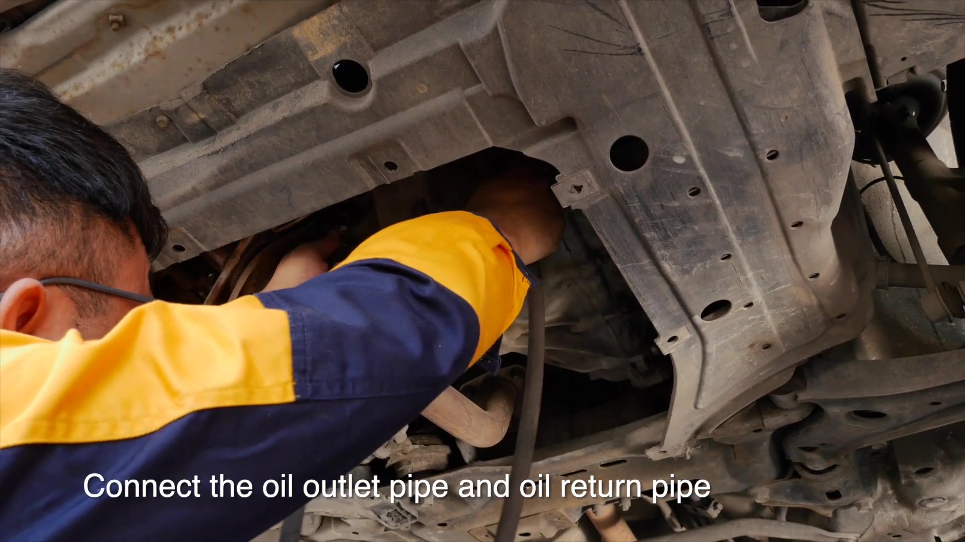 AUTOOL ATF702 outlet and return hoses connected at a vehicle transmission cooler circuit