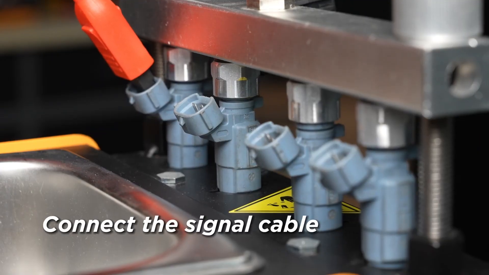 Close view of signal leads connected to injectors secured in an AUTOOL CT150.