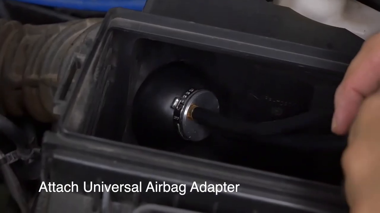Inflatable AUTOOL smoke-test adapter seated inside a rectangular intake opening.