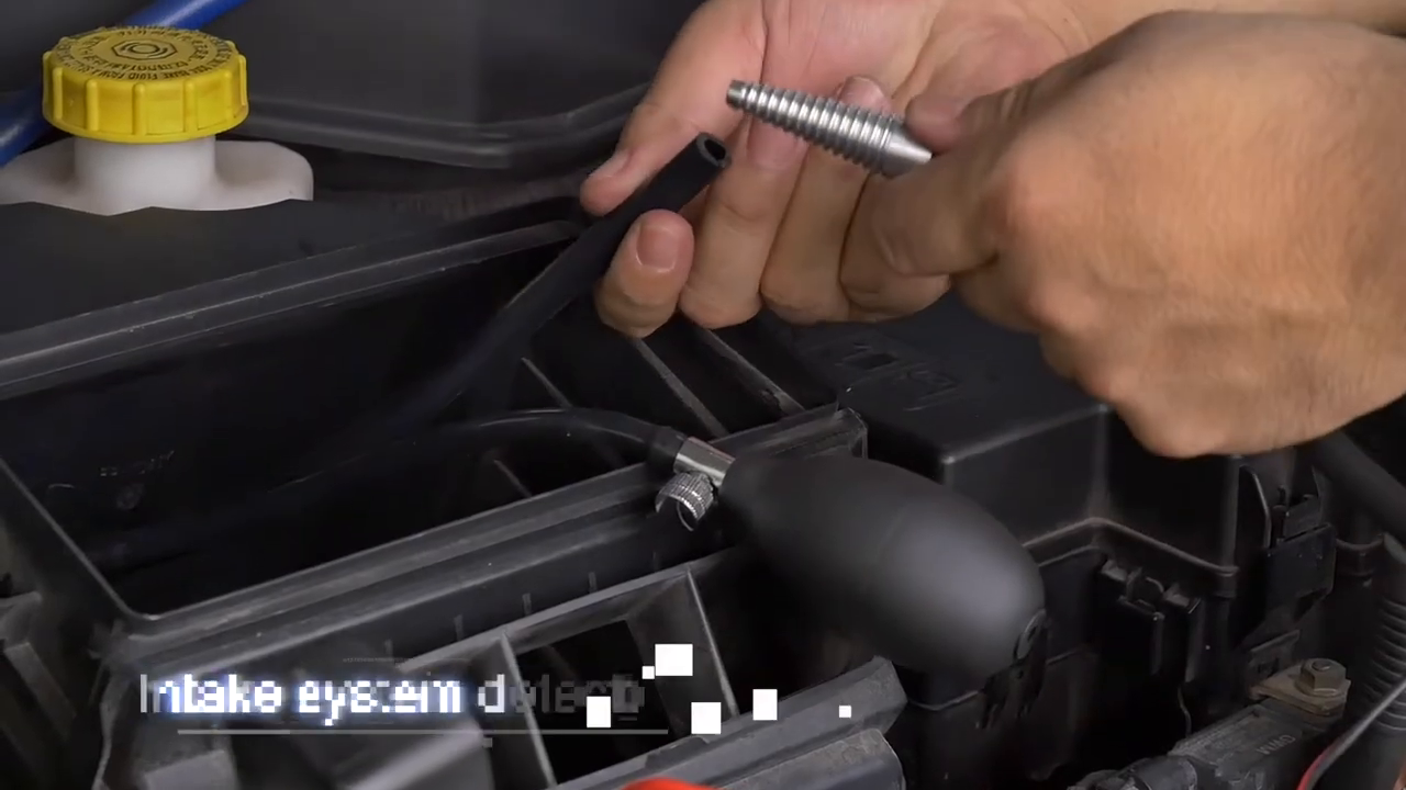 Technician connecting the smoke-machine hose to a seated inflatable intake adapter.