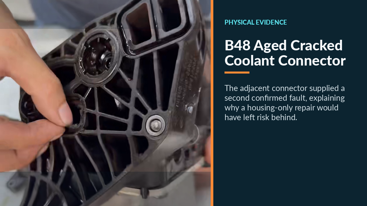 Close view of the aged BMW coolant-pipe connector that cracked at the block opening.