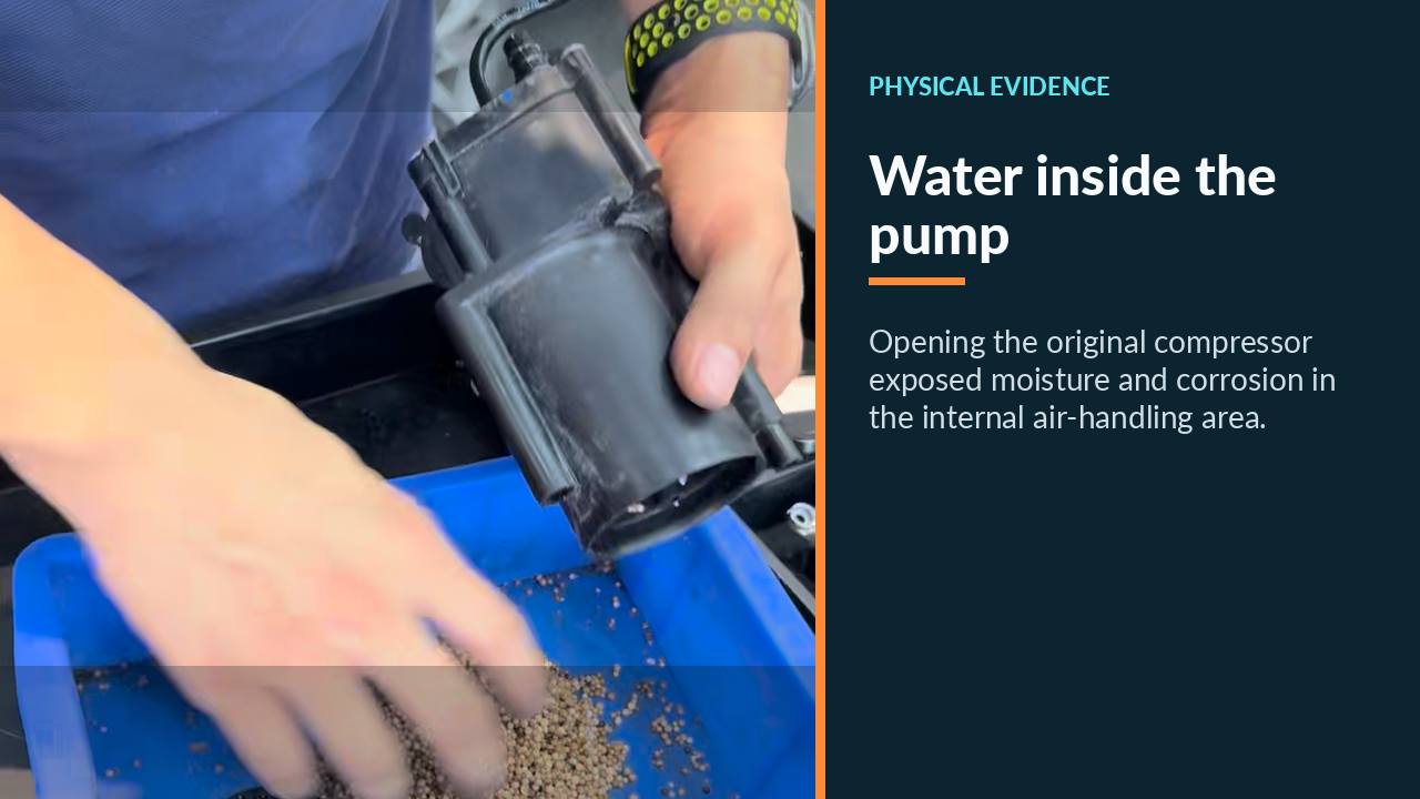 Opened BMW air-suspension compressor showing moisture-affected internal area