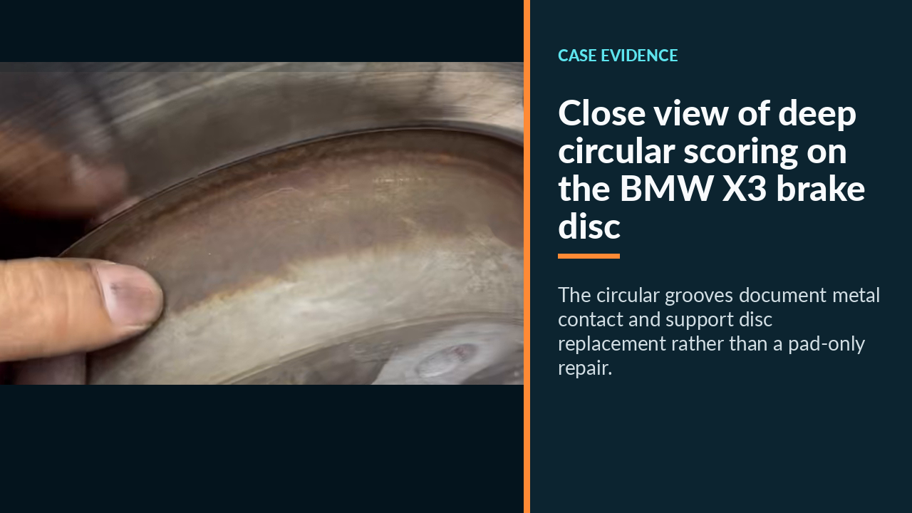 Close view of deep circular scoring on the BMW X3 brake disc