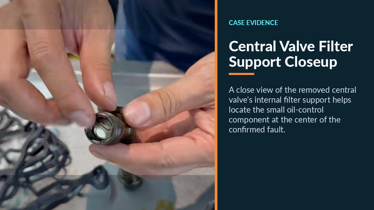 Close view of the removed central VANOS valve's internal filter support