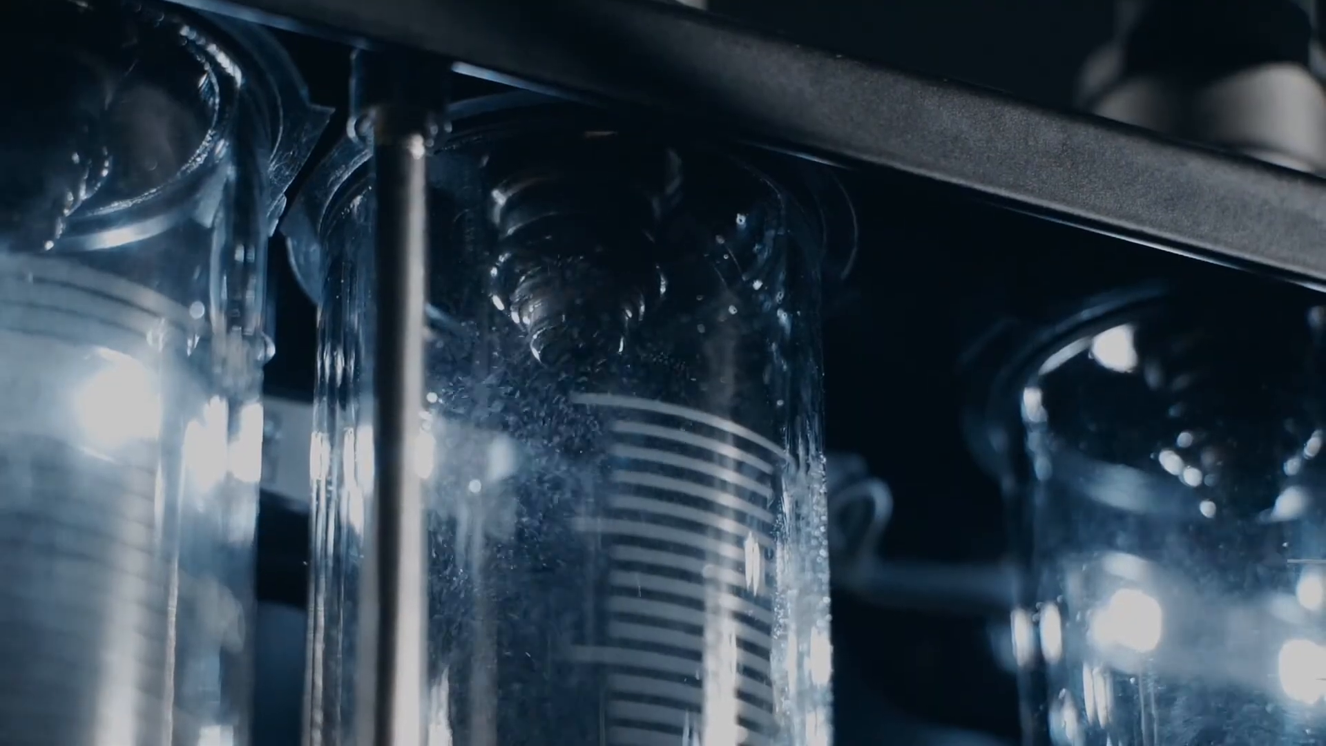 CT150 measuring cylinders showing side-by-side fuel injector spray patterns
