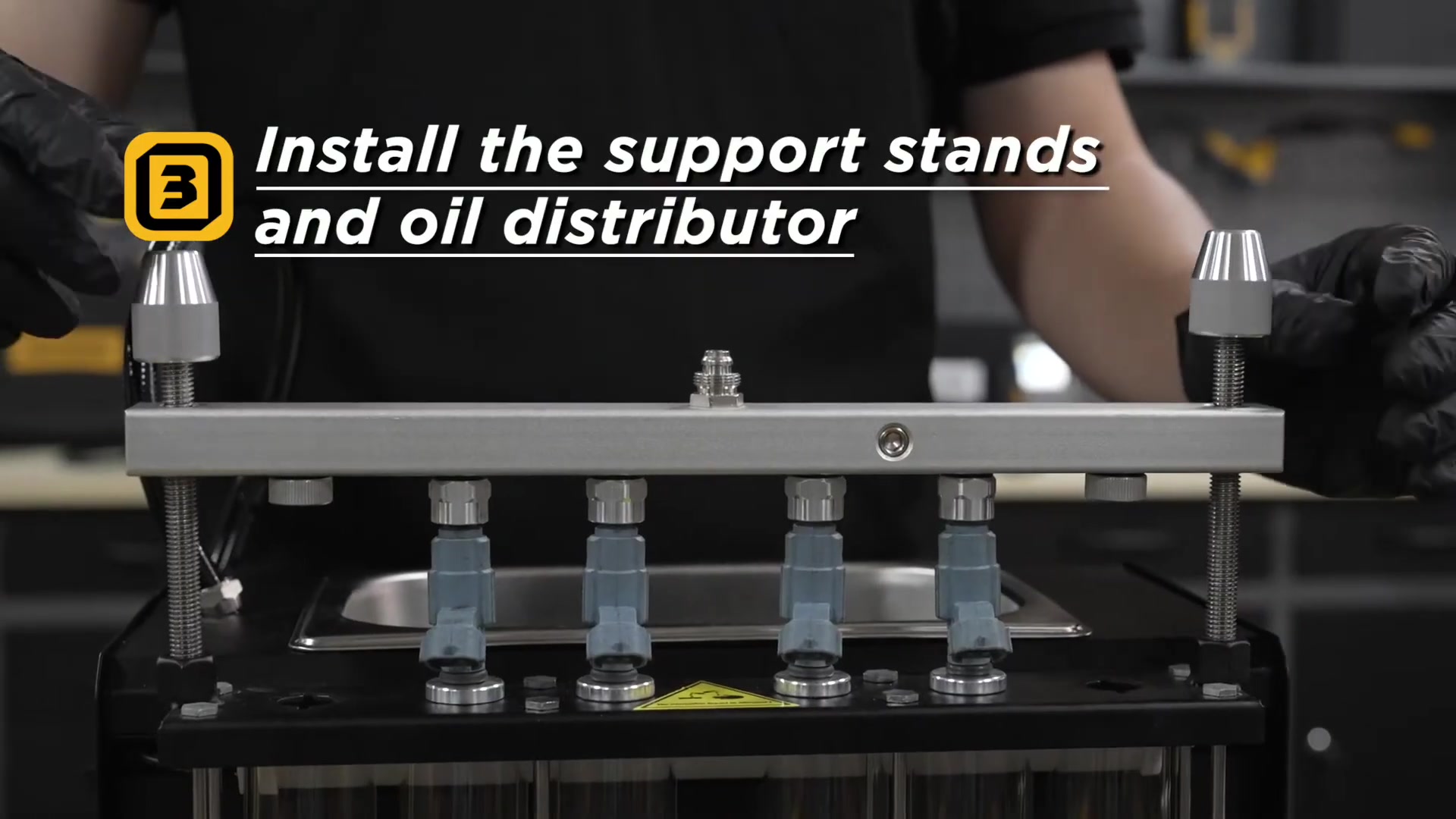Fuel injectors reverse-mounted below the AUTOOL CT500 oil distributor and support rail