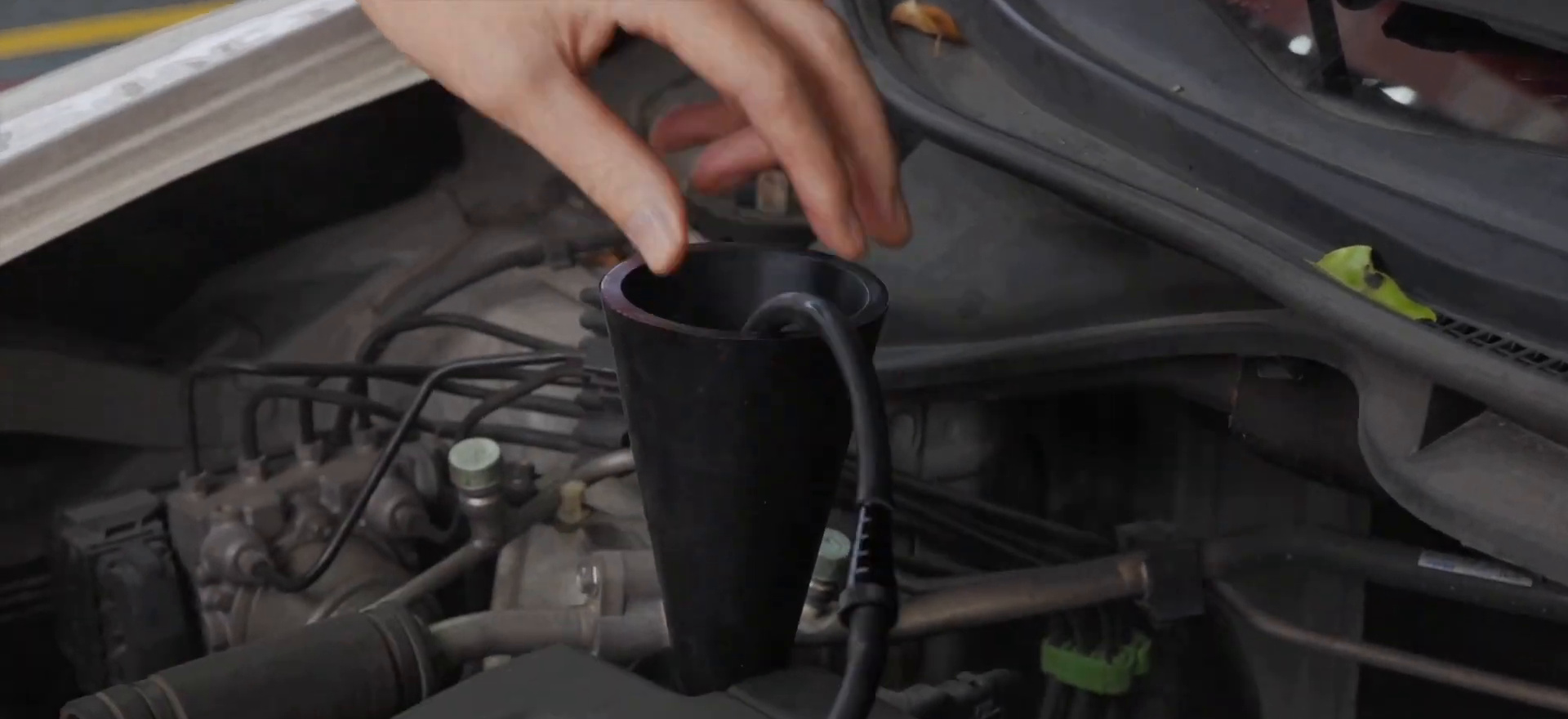 FXTUL F803 smoke nozzle seated through a cone adapter at an intake opening