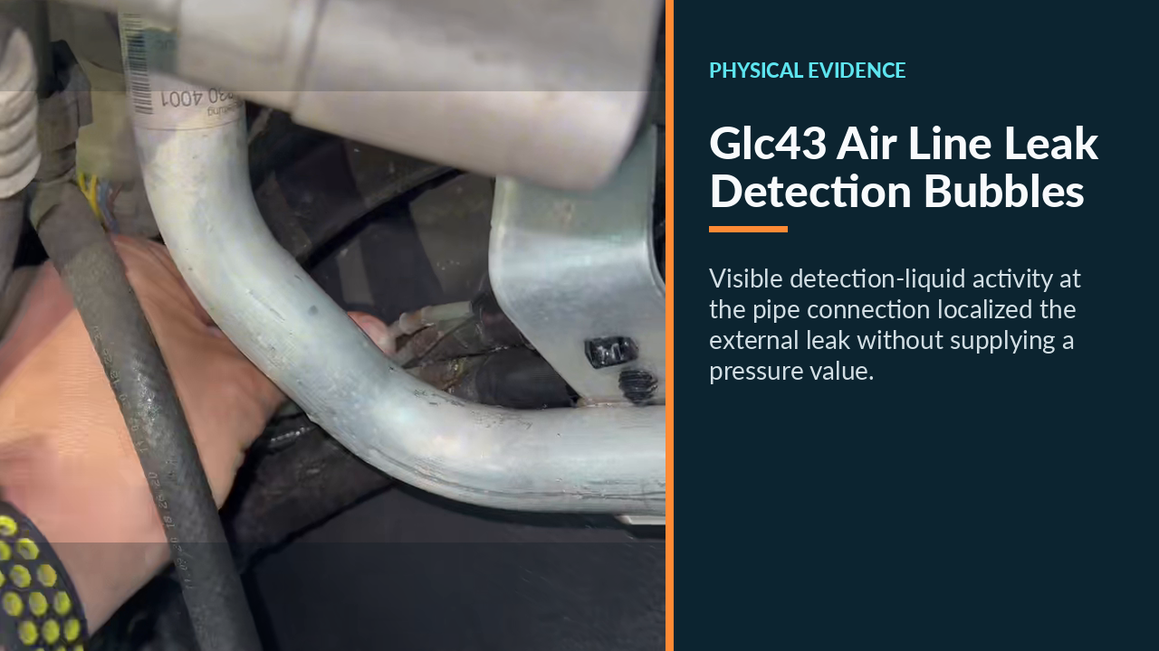 Leak-detection bubbles at the Mercedes GLC 43 air-suspension line connection.