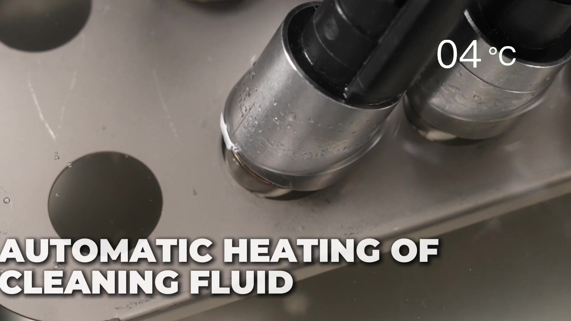 CT450 injectors in the ultrasonic bath while cleaning liquid begins automatic heating