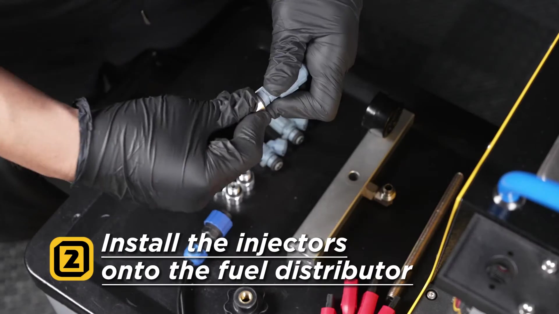 Injectors being installed under the CT160 fuel distributor