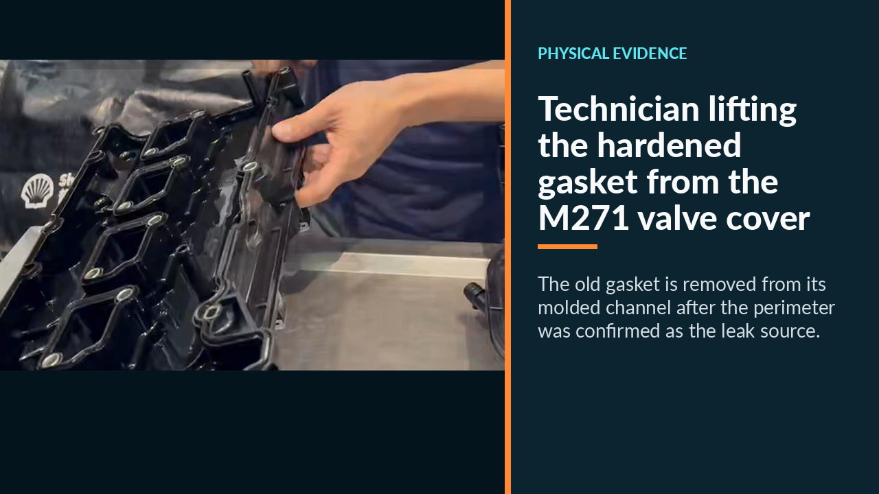 Technician lifting the hardened gasket from the M271 valve cover