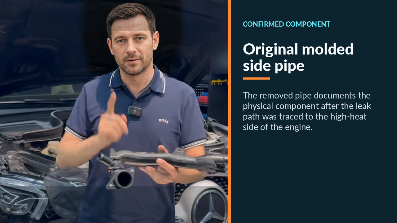 Technician holding the removed original Mercedes GLE 350 side coolant pipe