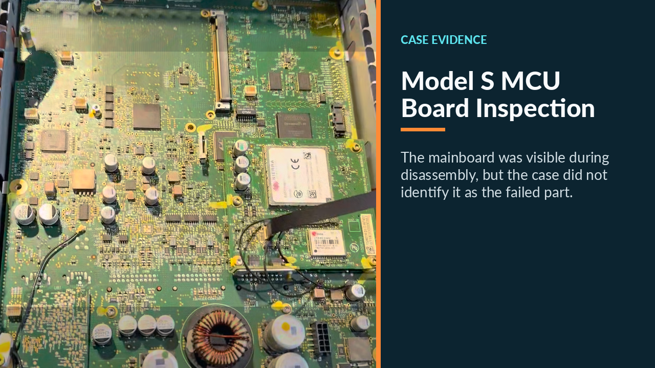 Opened Tesla Model S center assembly showing the MCU mainboard during display inspection.