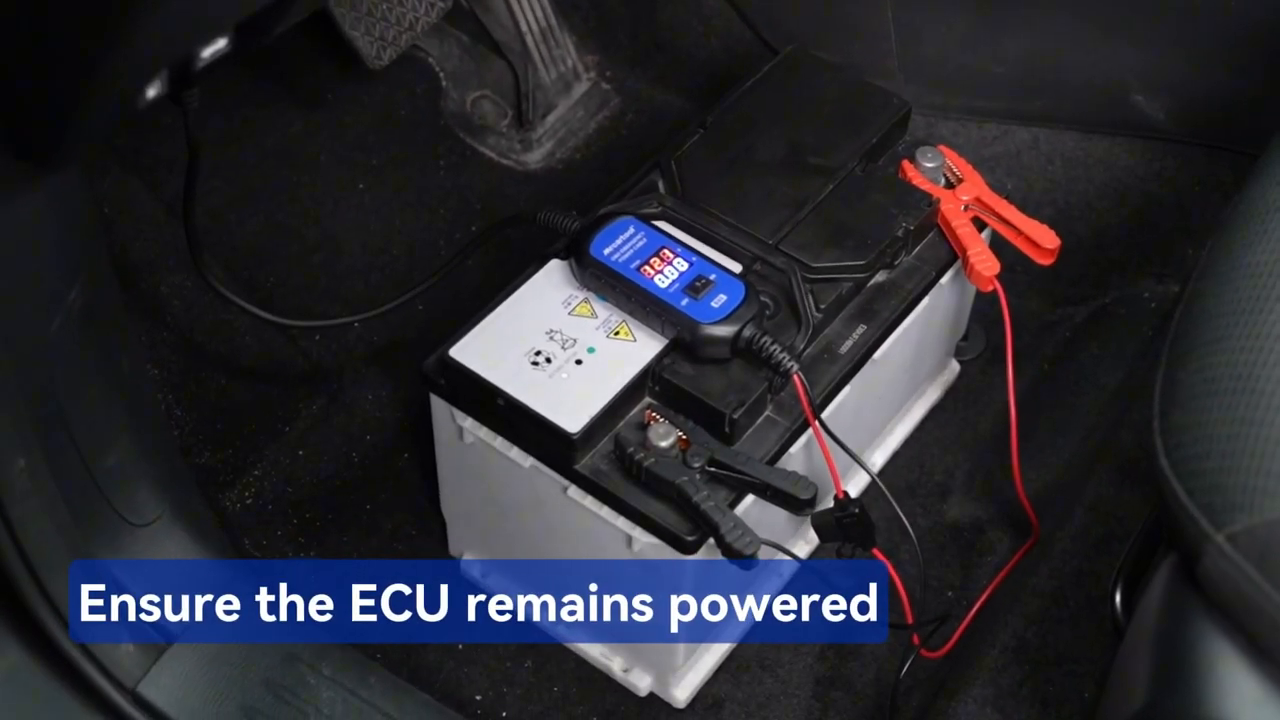 Official B80 tutorial frame showing the backup battery and OBD connection maintaining vehicle-module power.