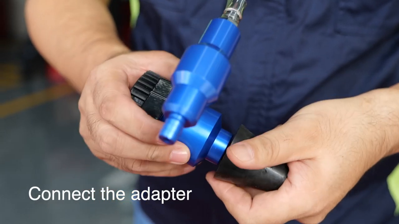 Official MRCARTOOL video frame showing the adapter being connected to the coolant refill tool.