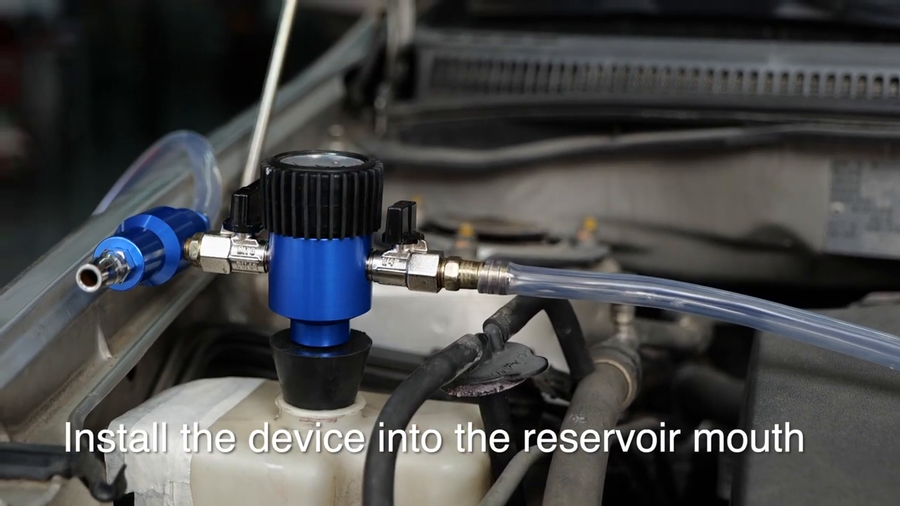 Official MRCARTOOL video frame showing the assembled tool installed upright in the coolant reservoir mouth.
