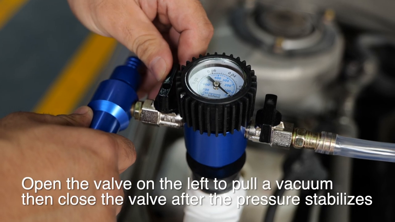 Official MRCARTOOL video frame showing valve 1 being operated while the gauge indicates cooling-system vacuum.