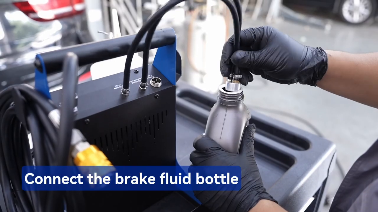 Official F109 tutorial frame showing a technician connecting the new brake-fluid bottle hoses.