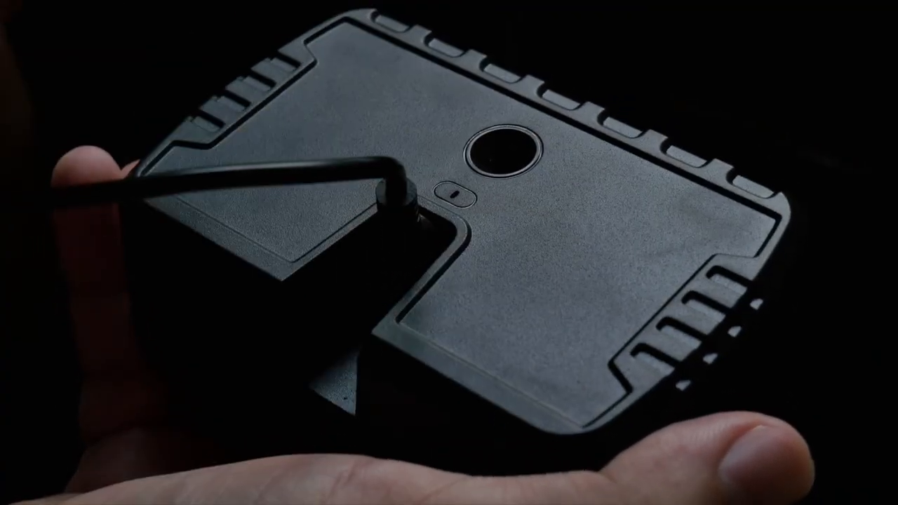 Frame from the official M85 demonstration showing the mini-USB cable connected to the rear of the display.