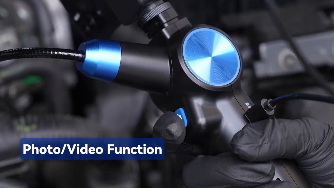 Technician using the N100 photo and video button during an engine inspection.