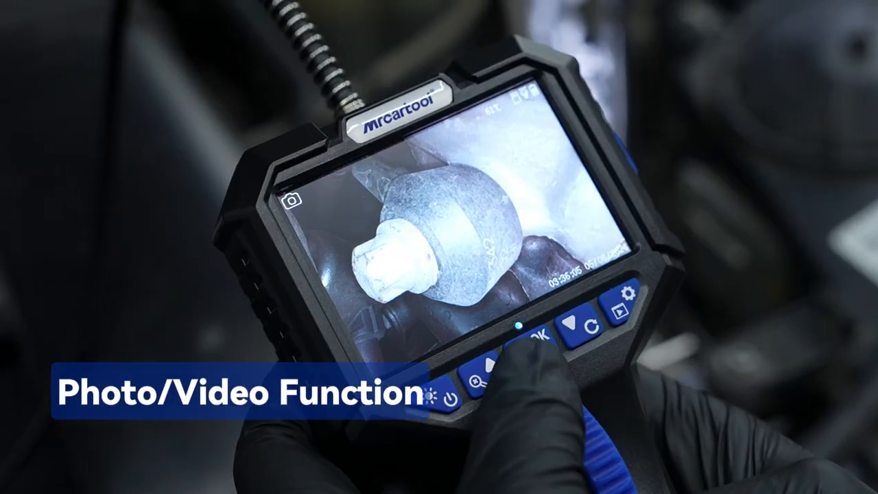 Technician using the N150 photo and video button during an engine inspection.