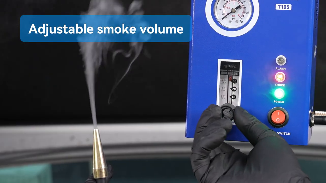 Technician adjusting the MRCARTOOL T105 smoke-flow control while watching the vertical meter.