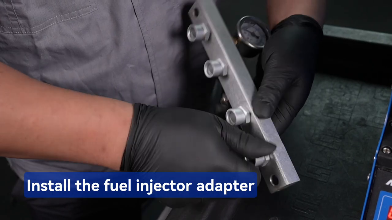 Technician installing a fuel injector adapter in the MRCARTOOL V209 distributor.