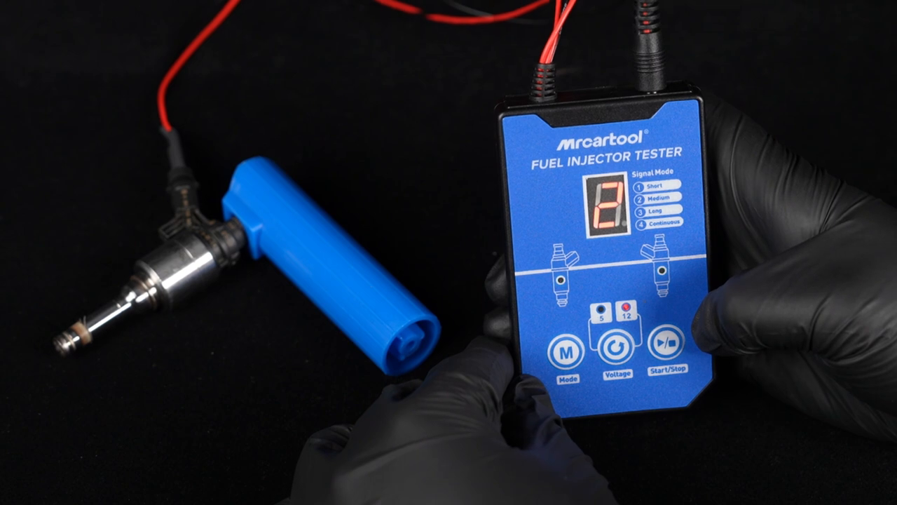 Technician selecting a program on the current MRCARTOOL V30 fuel injector tester.