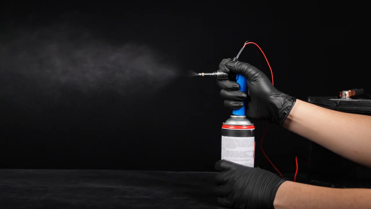 MRCARTOOL V30 pulsing an off-vehicle injector while a visible spray is directed away from the operator.