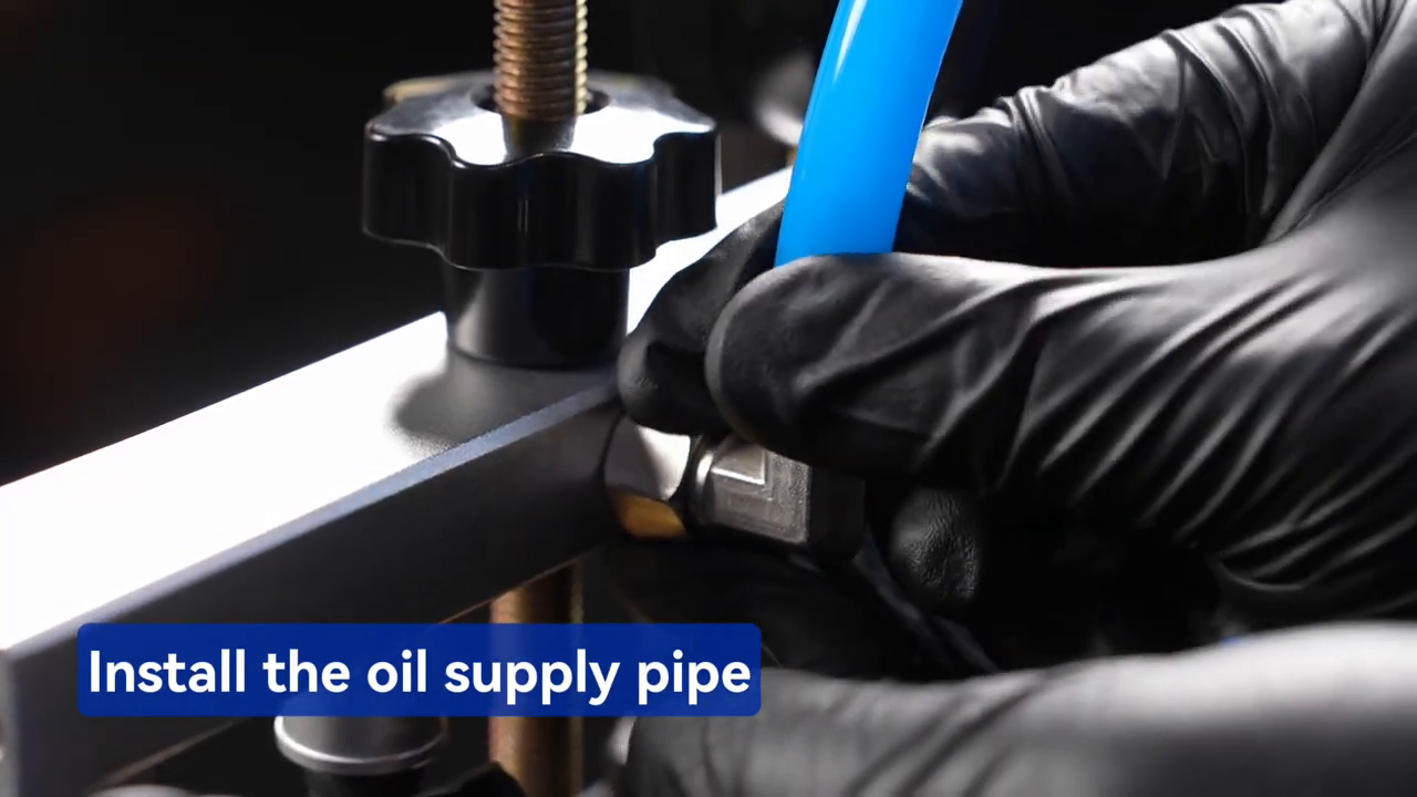 Technician attaching the blue oil-supply pipe to the secured MRCARTOOL V308 rail.