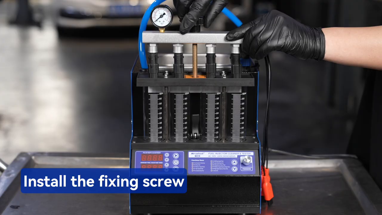 MRCARTOOL V308 oil rail secured over four measuring cylinders with locking rods.