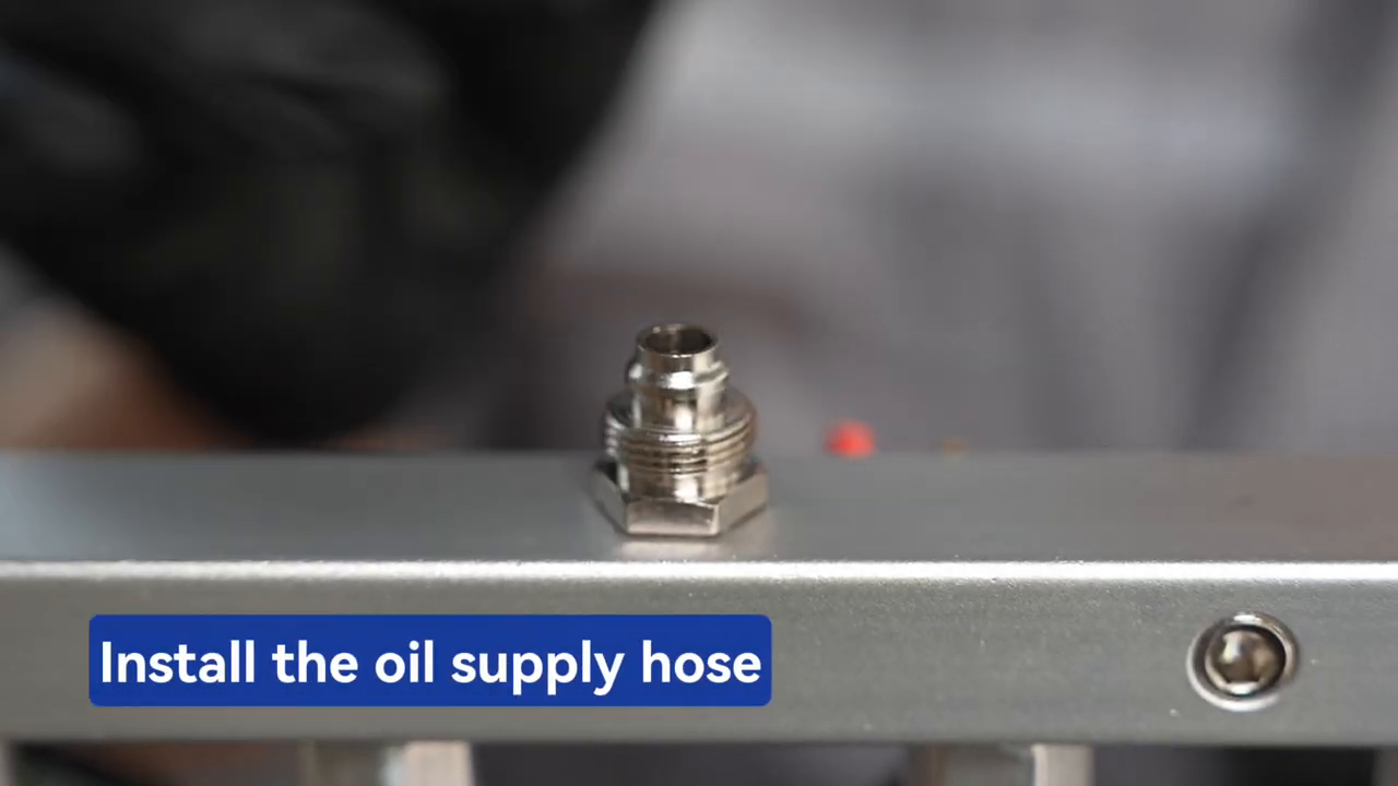 Technician installing the MRCARTOOL V310 oil-supply hose fitting.