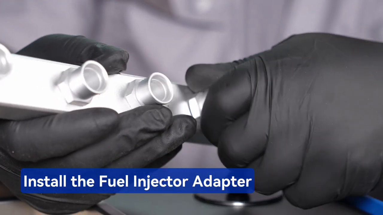 Technician fitting a metal MRCARTOOL V311 rail adapter to an injector.