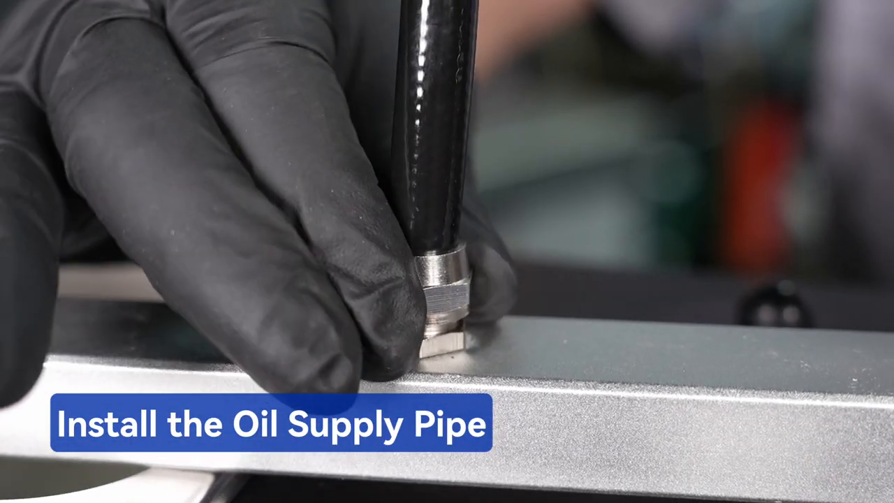 Technician installing the MRCARTOOL V311 oil-supply hose fitting.