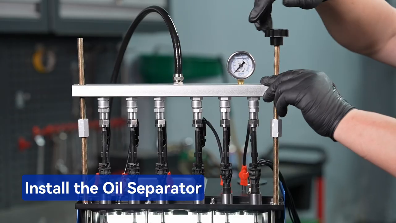 MRCARTOOL V311 oil separator being installed over the six measuring cylinders.