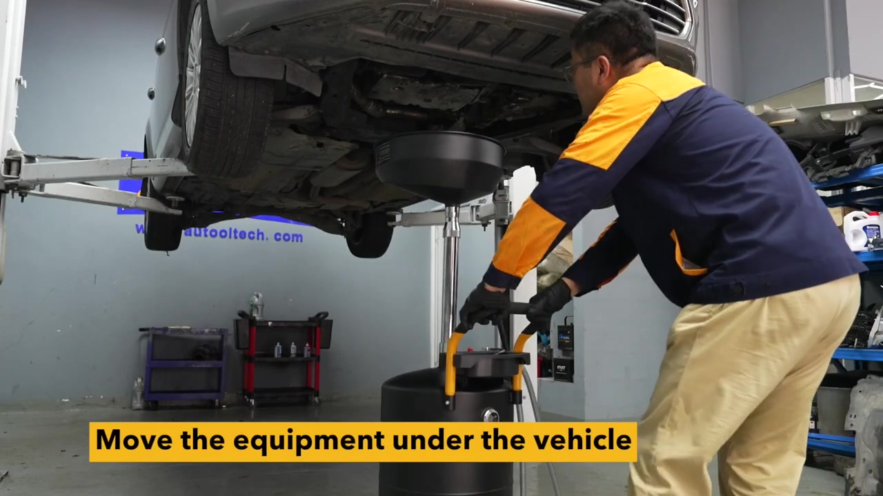 AUTOOL OD710 being moved by its handle beneath a vehicle supported on a workshop lift