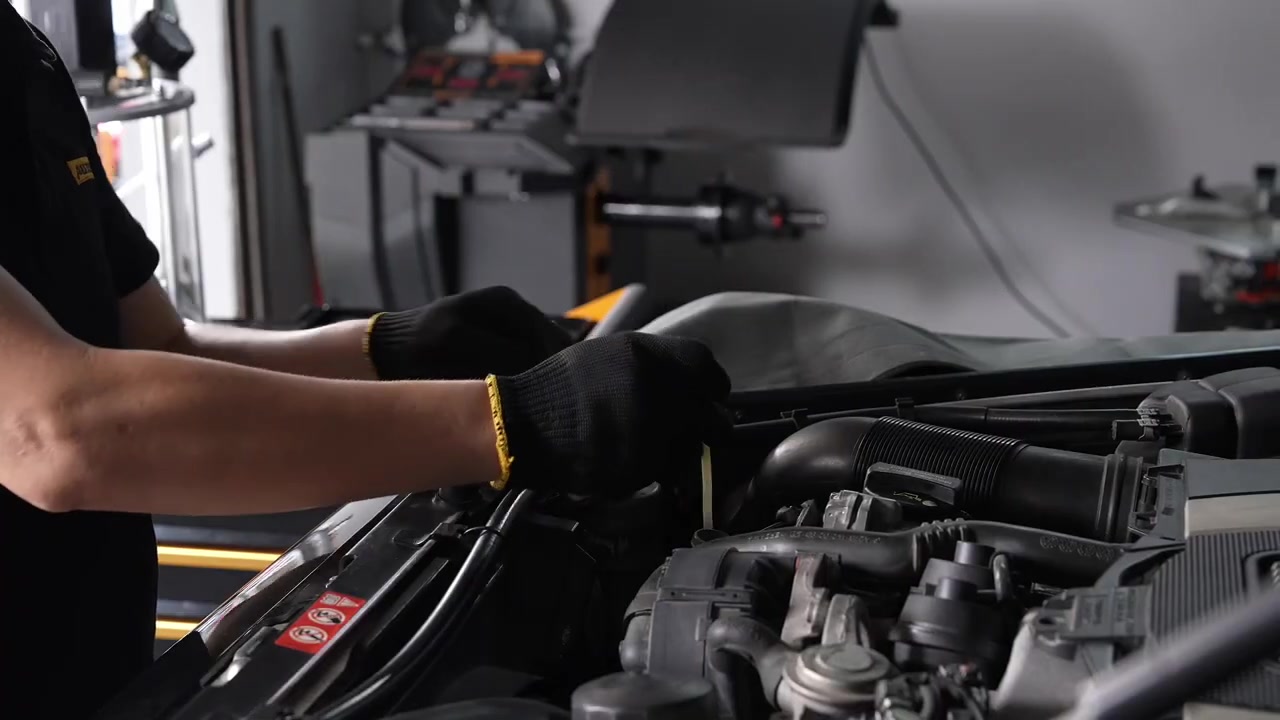 AUTOOL OD760 oil extraction probe being guided into an identified vehicle service tube