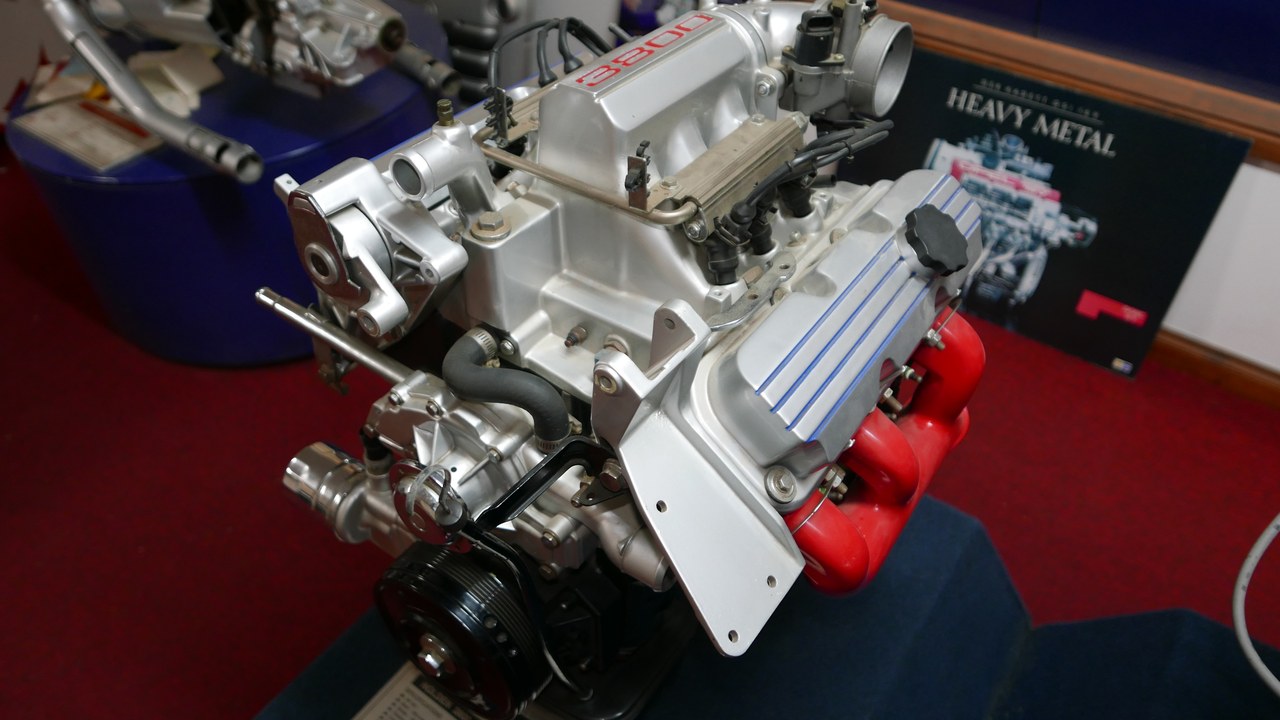 Automotive V6 engine showing its accessory-drive pulleys and belt system