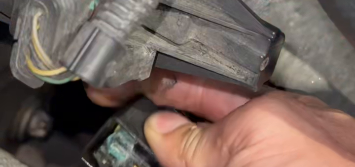 Close view of residue and discoloration inside the water-pump connector.